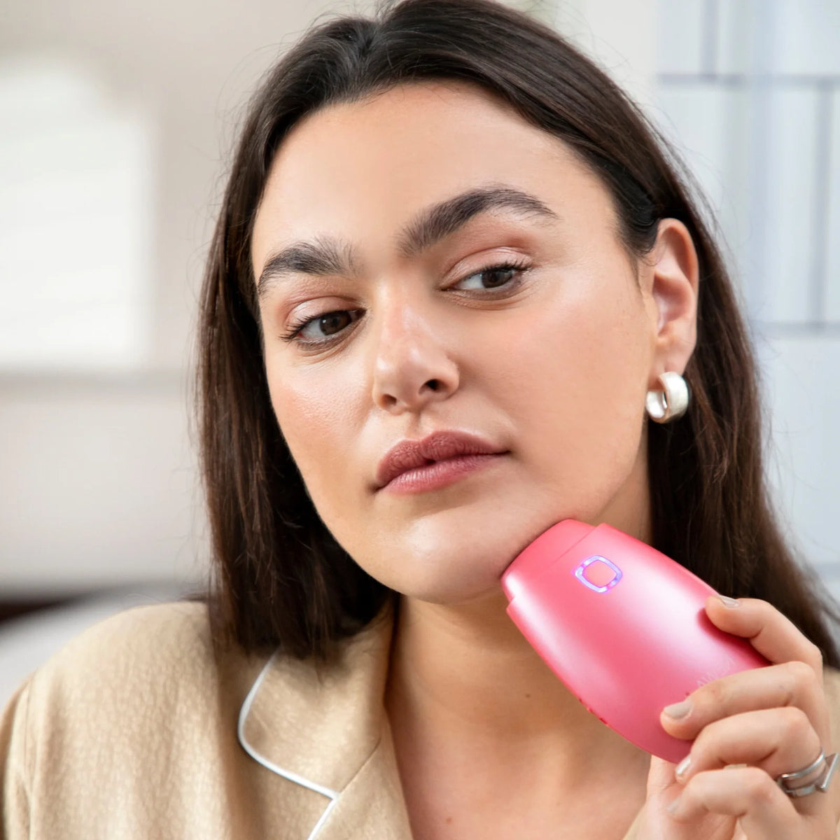 At-home radio frequency skincare device shown for facial treatment