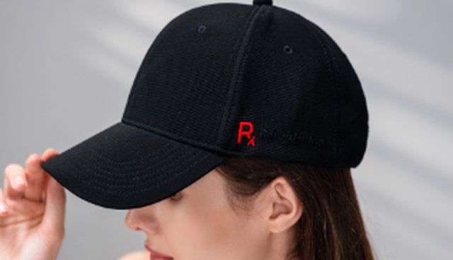 Side view of the Rajani MD PlasmaGLO™ Hair+ Cap, showing its cordless cap design for scalp light therapy.