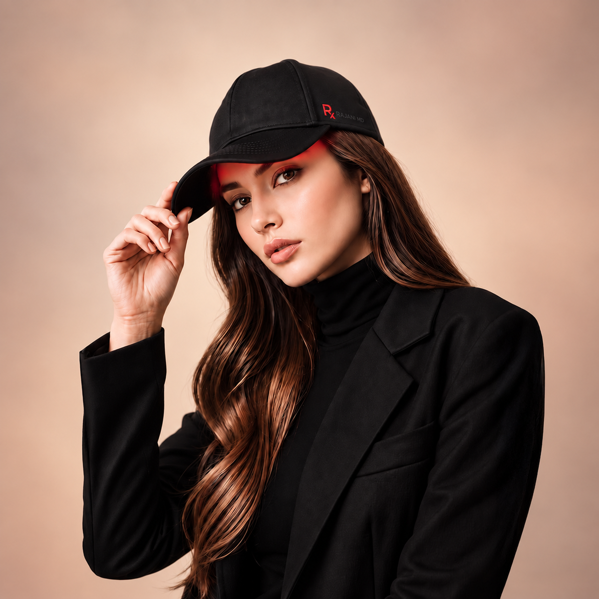 Woman modeling the Rajani MD PlasmaGLO™ Hair+ Cap, an at-home light therapy device FDA-cleared for androgenetic alopecia.